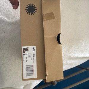 Tan Ugg kid’s boots